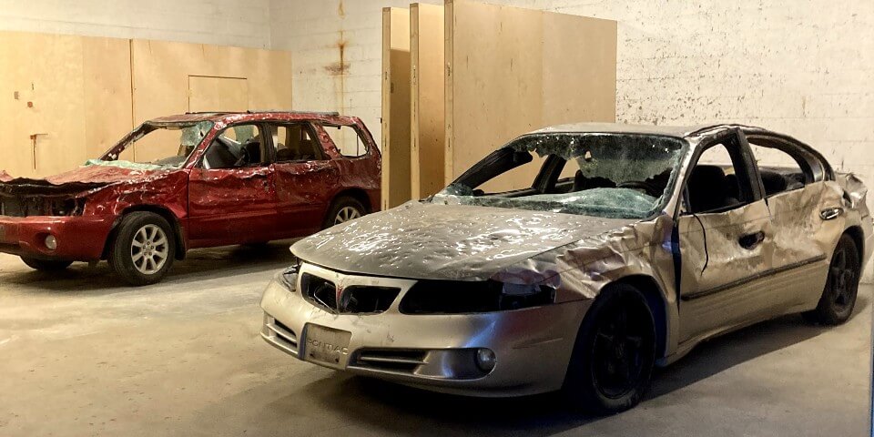 image of two cars which have obviously been hit multiple times during a smash session but are still in pretty good shape